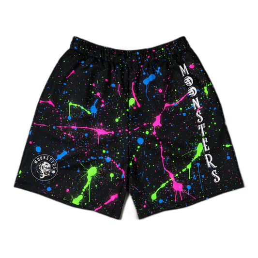 Black shorts with neon green, pink, and blue paint splatter, elastic waistband, and white "MONSTERS" text on right leg.