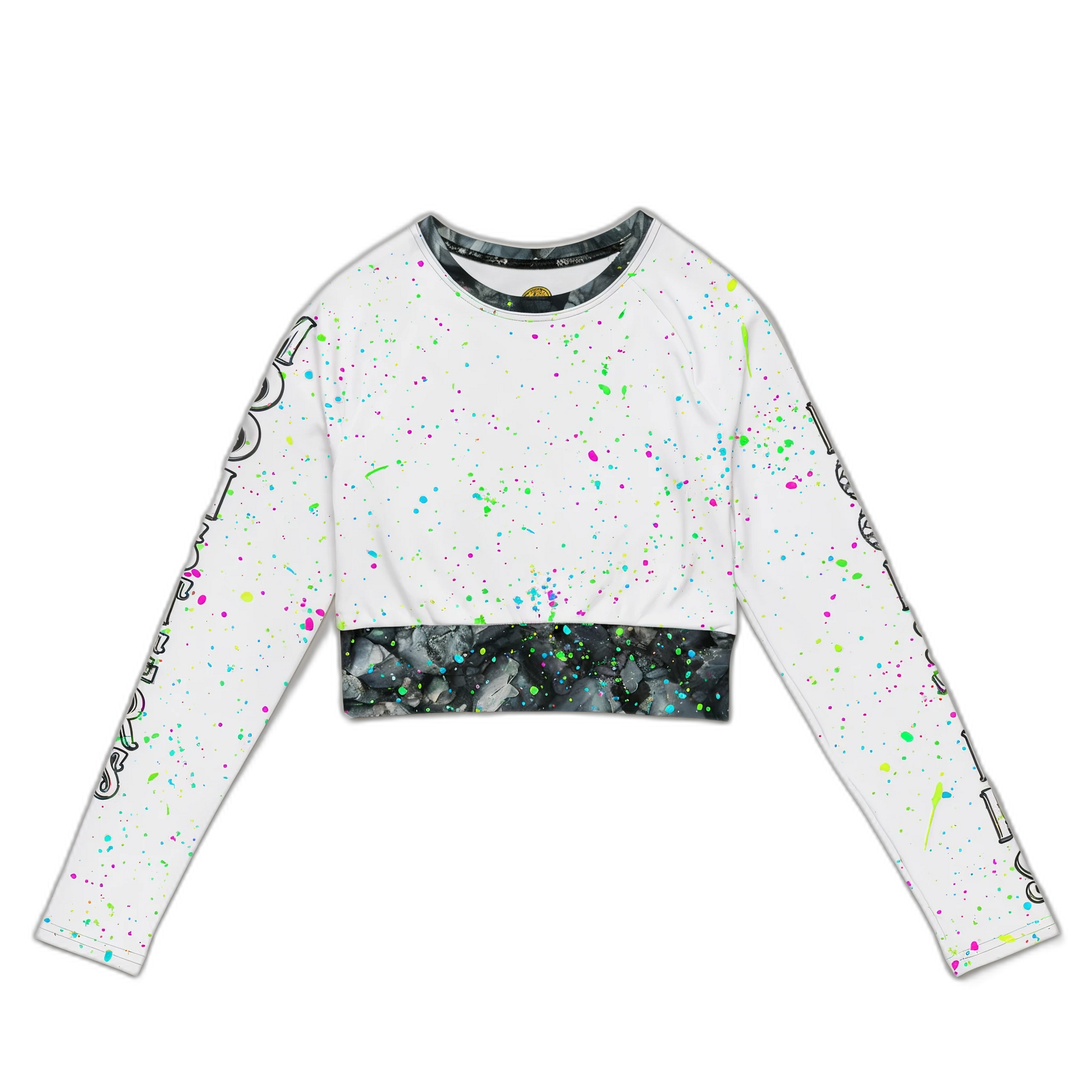 White cropped long-sleeve top with neon paint splatter and black marble-patterned hem and collar trim.