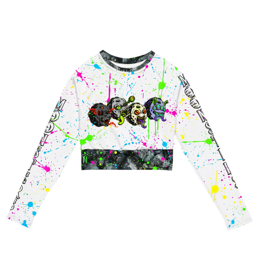 White long-sleeve cropped top with colorful paint splatters and Moonsters characters designs across the chest.