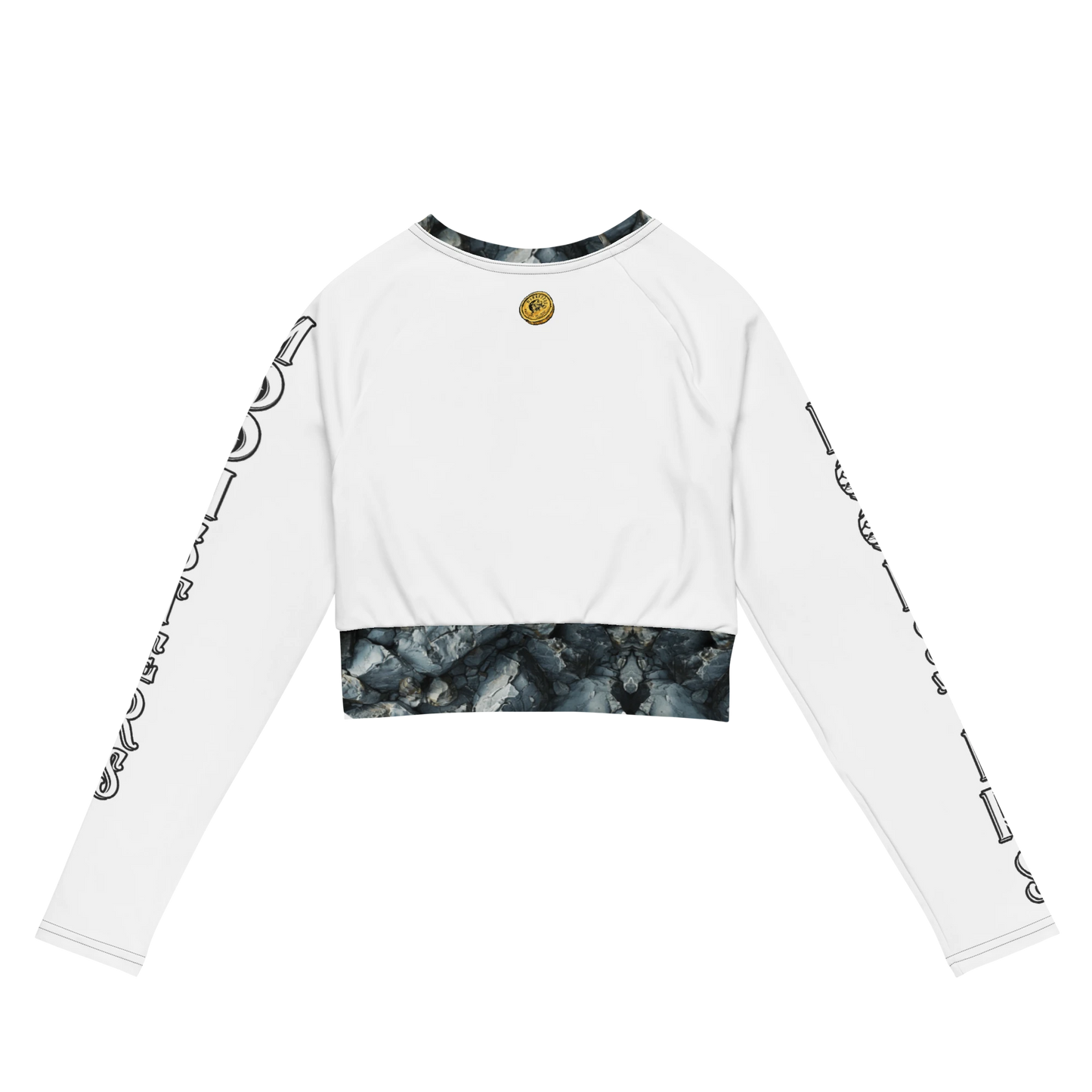 White long sleeve crop top with black tie-dye trim on cuffs and hem, gold round emblem on chest.