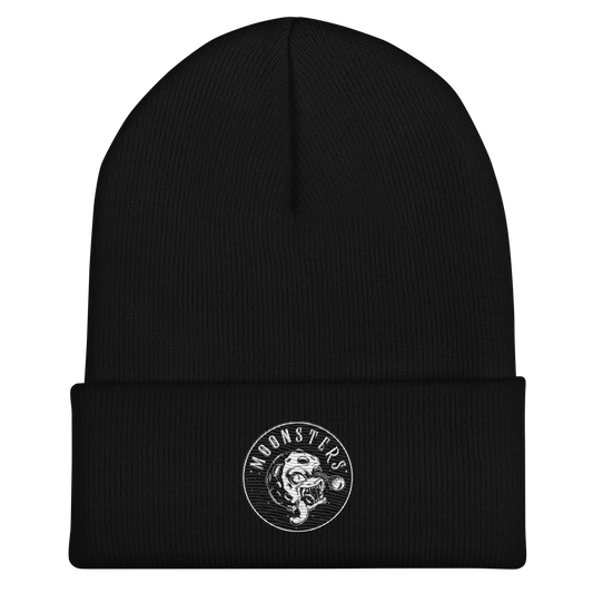 Black knit beanie with cuff and round white Moonsters stamp logo on front.